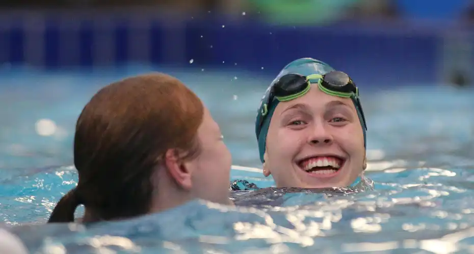 Two Exeter Sport members swimming together.