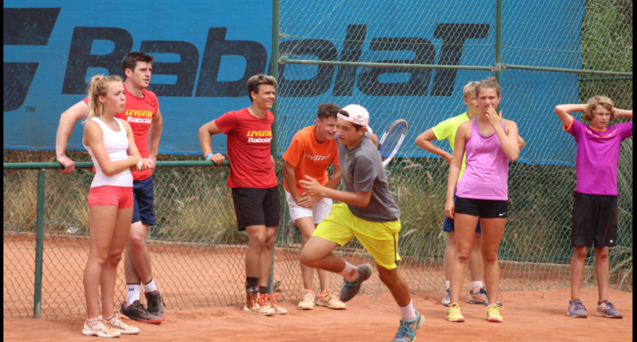 Junior Tennis and guy in the sun